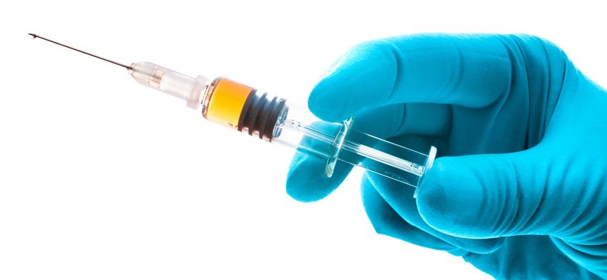 Hand holding syringe isolated on white; Shutterstock ID 107822207; PO: The Huffington Post; Job: The Huffington Post; Client: The Huffington Post; Other: The Huffington Post