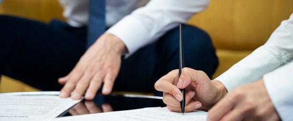 people-signing-documents-side-view_23-2149445770