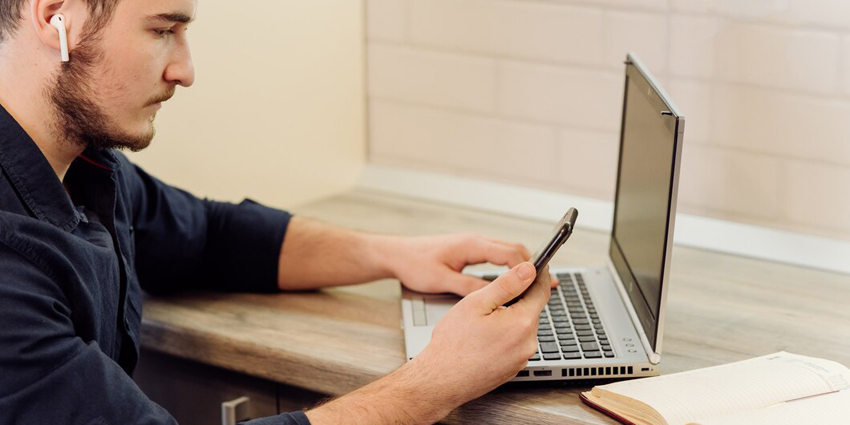 young-businessman-working-with-computer-remotely_1328-3387